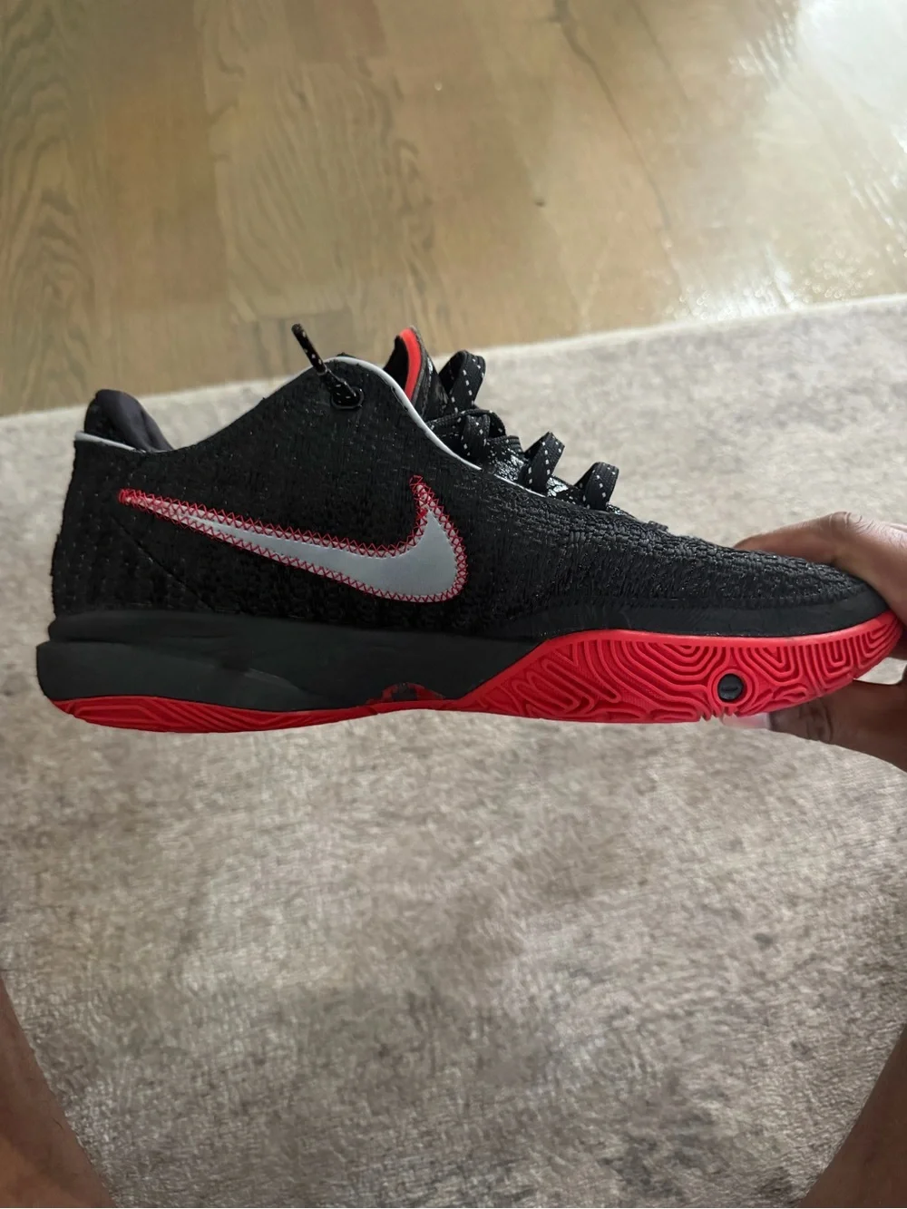 Nike LeBron 21… Men’s Black Knit Sneaker with Red Outsole and Gold Swoosh